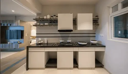 Fitted kitchen with hob and overhead units